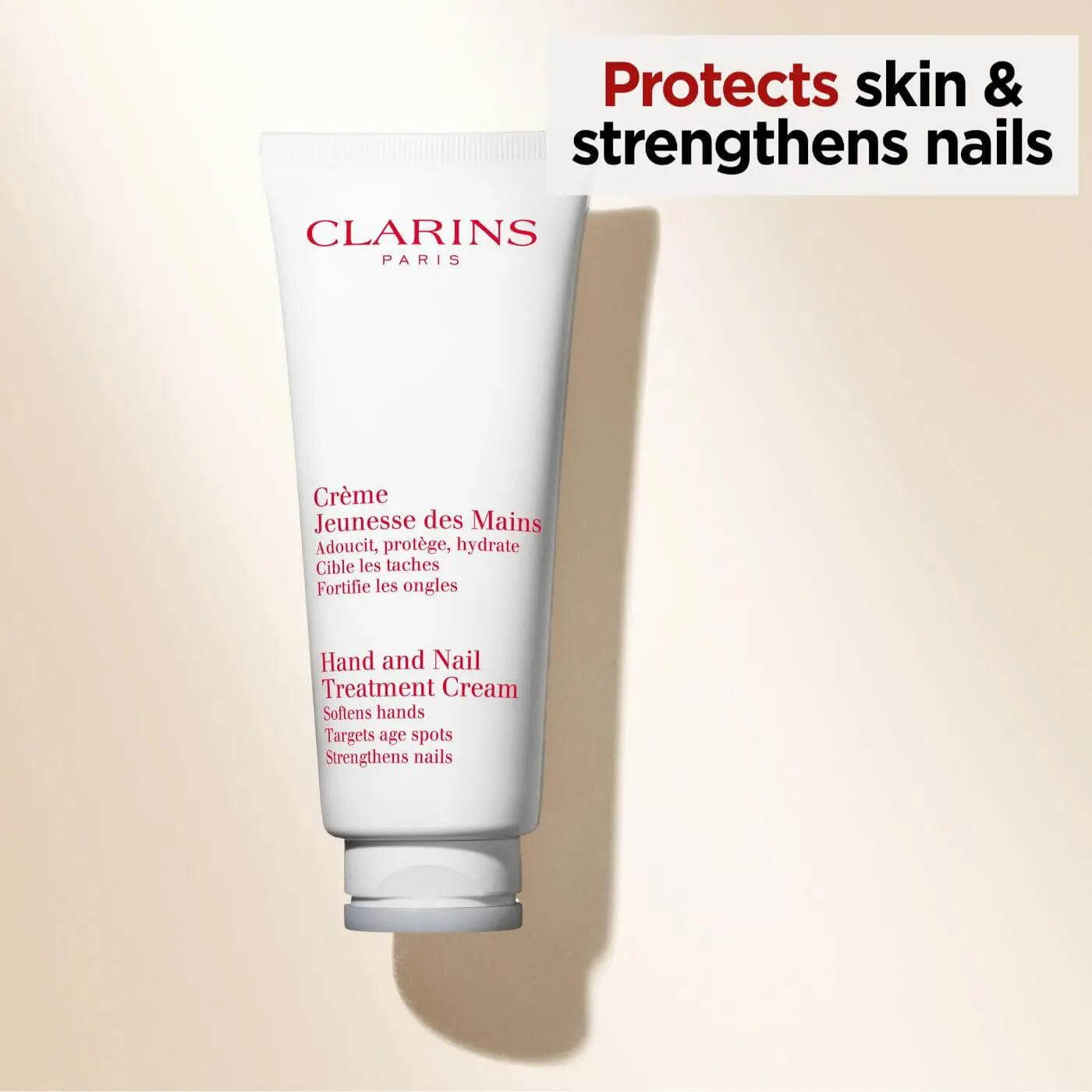 Clarins Hand & Nail Treatment Cream tube, enhances skin health and strengthens nails with shea butter and sesame oil.