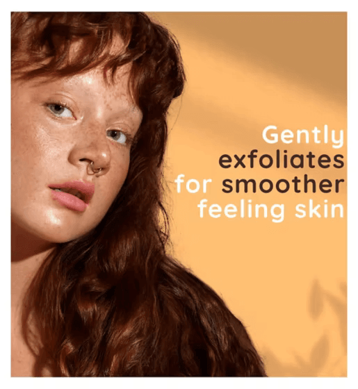 Woman with curly red hair showcasing smooth skin with text about gentle exfoliation benefits.