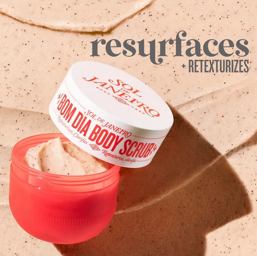 Sol de Janeiro Bom Dia Body Scrub 220g in a pink jar on exfoliating surface, promotes skin resurfacing and retexturizing.