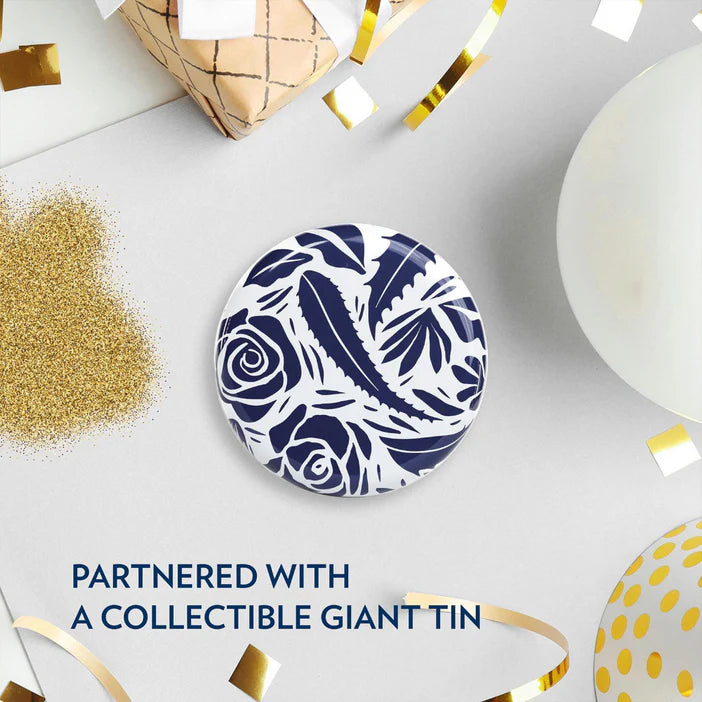 Decorative plate with blue floral pattern on a white surface with festive elements.