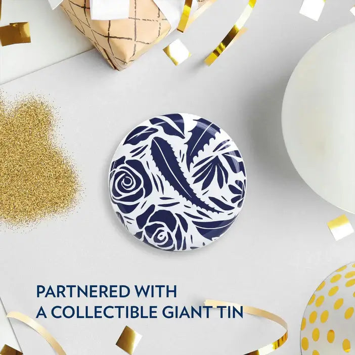 Decorative plate with blue floral pattern on a white surface with festive elements.