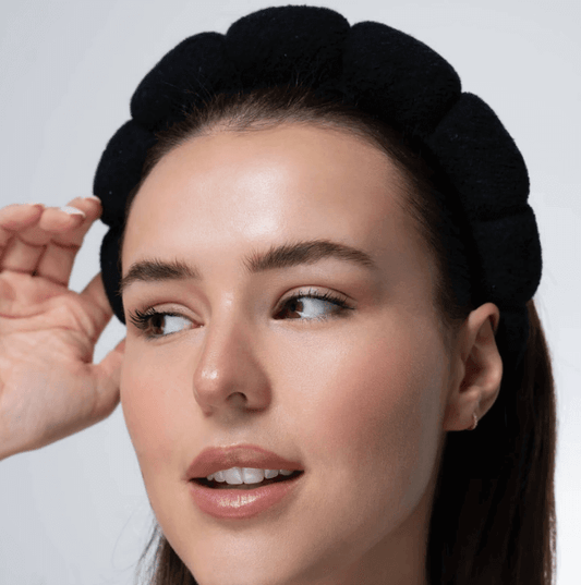 Brushworks Black Cloud Headband in black on a model, showcasing a bubble design for skincare routines.