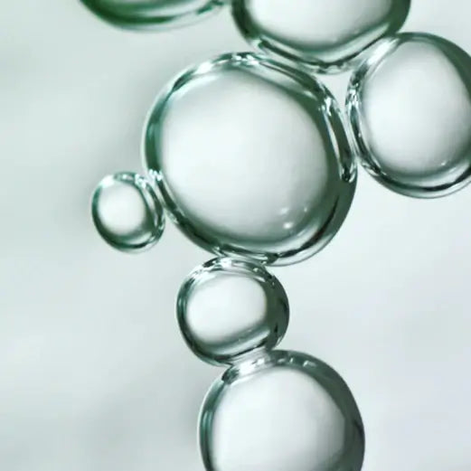 Clear bubbles floating gracefully, symbolizing hydration and freshness in skincare.