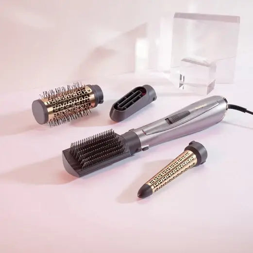 BaByliss Air Style 1000 styling tool with attachments for versatile hair styling.