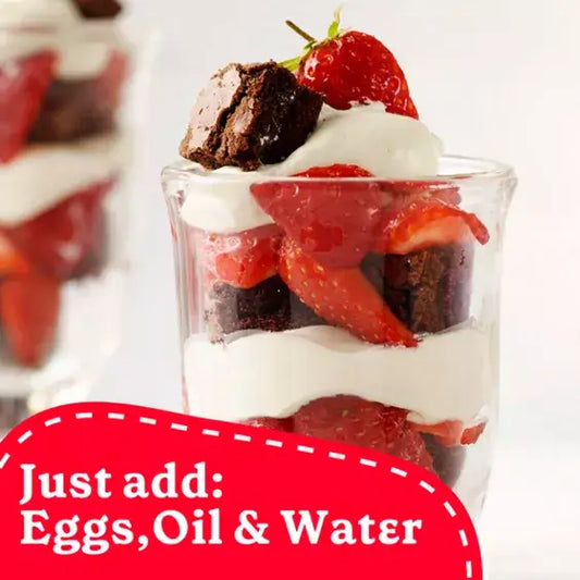 Delicious dessert parfait with brownie pieces, strawberries, and whipped cream, featuring simple ingredients to add.