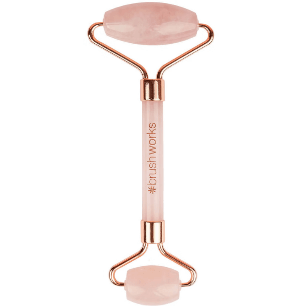 Brushworks Brazilian Rose Quartz Stone Roller for facial massage, promoting blood flow and enhancing skincare absorption.