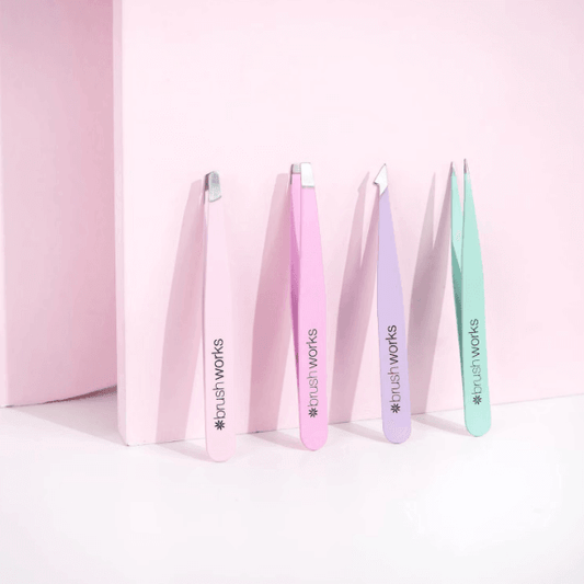 Brushworks HD Combination Tweezer Set in pastel colors for eyebrow grooming and precision.