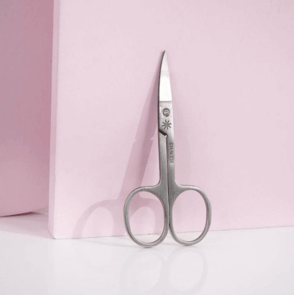 Brushworks Nail Scissors on a pink background, perfect for precise nail trimming and safe for children's use.