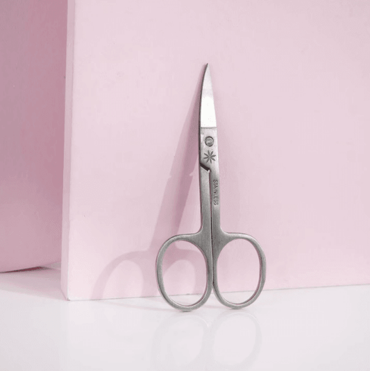 Brushworks Nail Scissors on a pink background, perfect for precise nail trimming and safe for children's use.