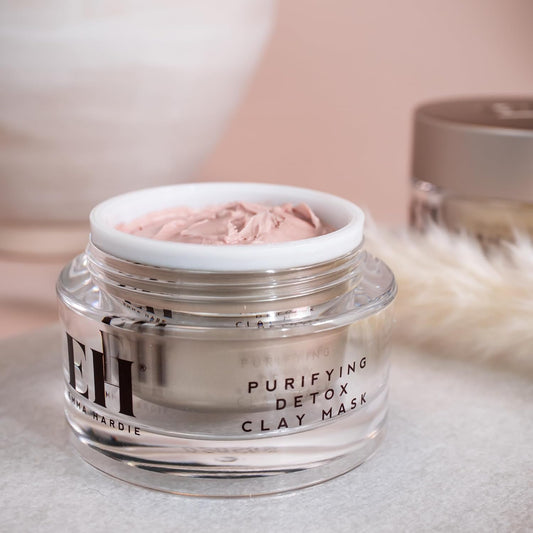 Jar of Emma Hardie 'Purifying Detox Clay Mask' with pink clay on a neutral background
