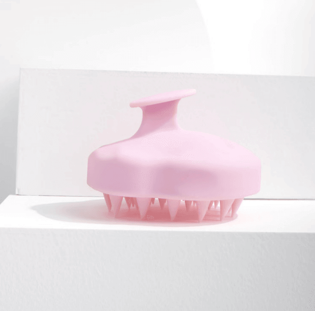 Brushworks Massaging Shampoo Brush in pink, designed for scalp exfoliation and hair growth stimulation.