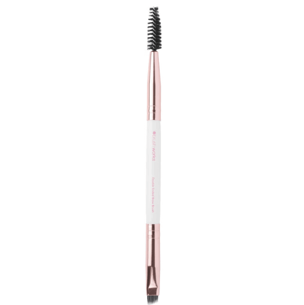 Brushworks White and Gold Brow Duo Brush for easy brow grooming and highlighting, featuring a spoolie and angled brush.