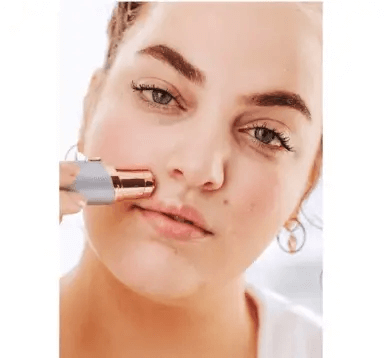 Woman using Finishing Touch Flawless™ Face 3.0 to remove unwanted facial hair effortlessly.