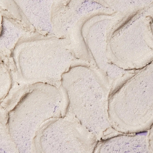 Close-up of the First Aid Beauty KP Bump Eraser Body Scrub showing its creamy texture and exfoliating properties.