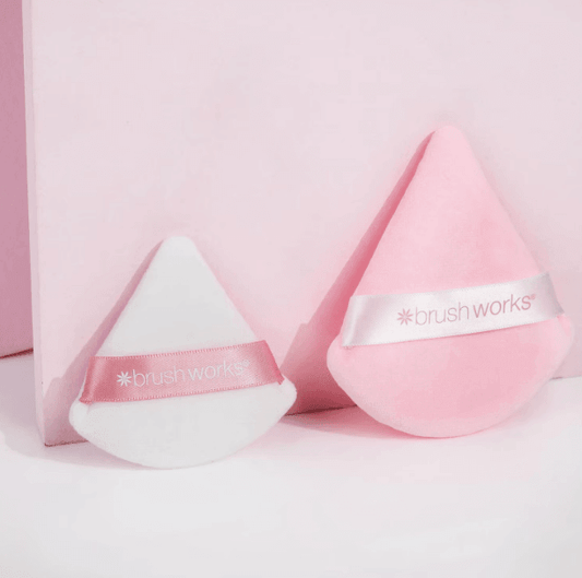 Brushworks Triangle Powder Puff Duo featuring a pink and white cosmetic sponge set for flawless application.