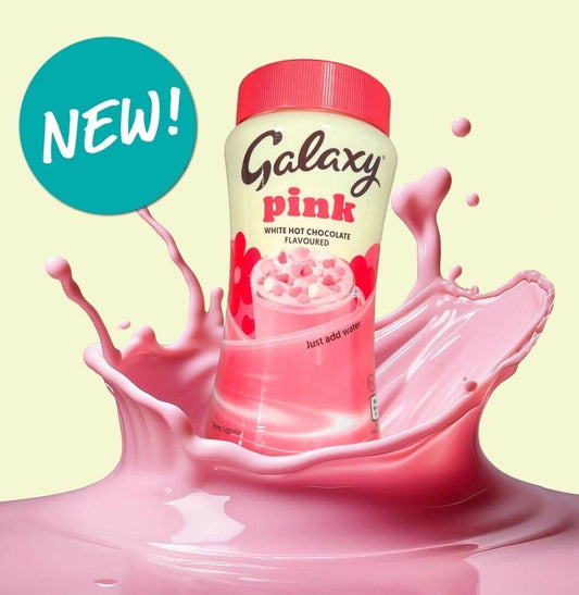 Galaxy Pink Hot Chocolate canister with splash of creamy pink drink, labeled 'NEW!' and 'Just add water'.