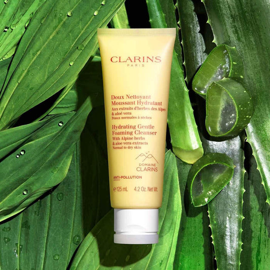 Clarins Hydrating Gentle Foaming Cleanser 125ml on aloe vera background, suitable for normal to dry skin, anti-pollution formula.