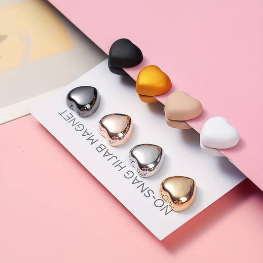 Magnetic hijab pins set in heart shapes, featuring various colors, perfect for secure and damage-free hijab styling.