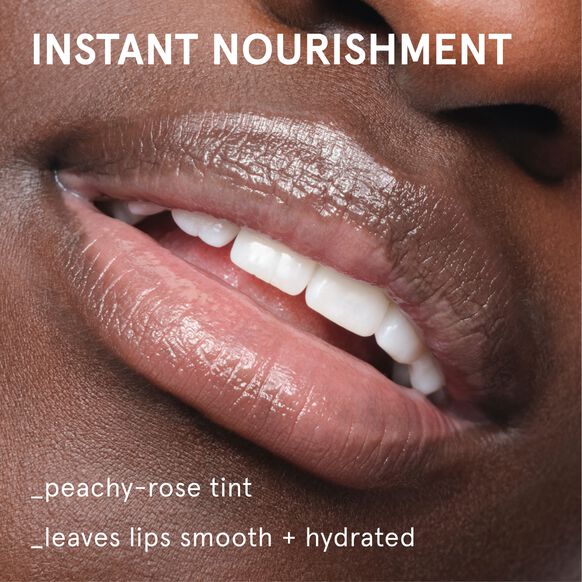 Glossier Close-up of lips with 'Instant Nourishment' text and peachy-rose tint description.