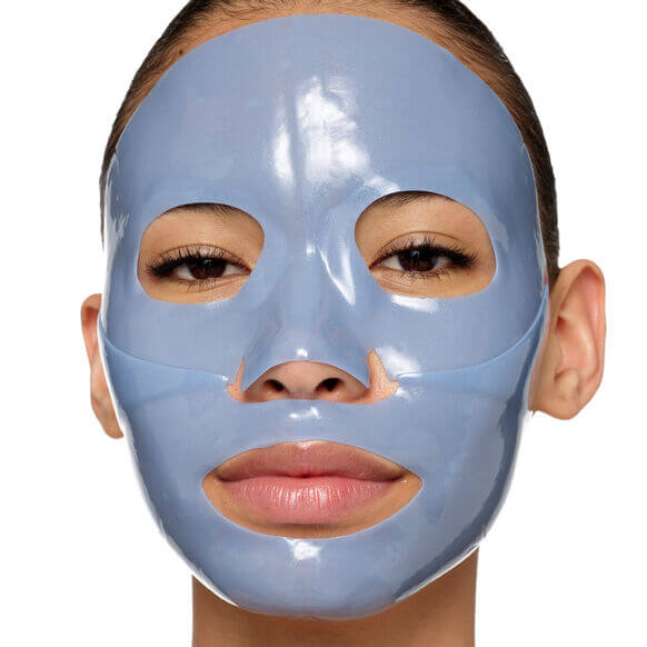 Model wearing 111SKIN Cryo De-Puffing Energy Mask for radiant, energized skin.