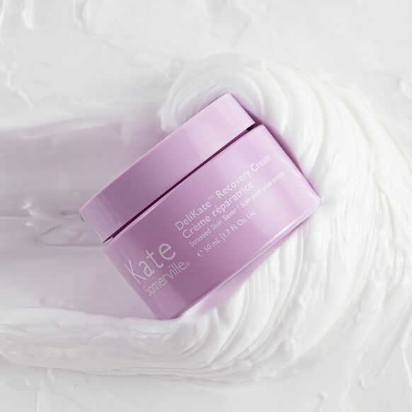 Purple jar of Kate Somerville skincare cream on a white background
