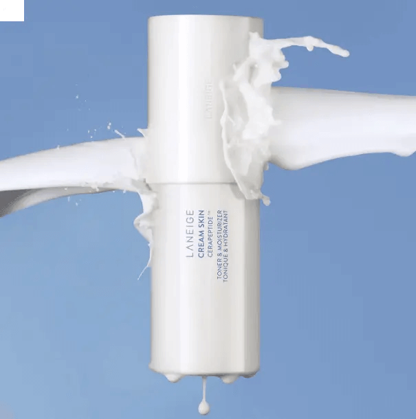 LANEIGE Cream Skin Cerapeptide Toner and Moisturiser 170ml with splashing cream against a blue background