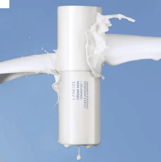 LANEIGE Cream Skin Cerapeptide Toner and Moisturiser 170ml with splashing cream against a blue background