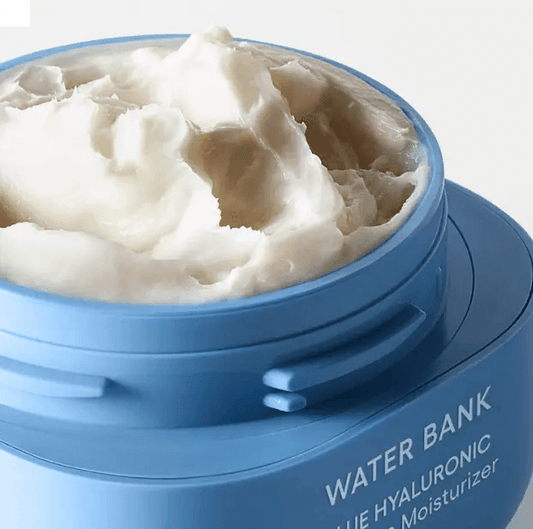 Close-up of LANEIGE Water Bank Blue Hyaluronic Acid Intensive Cream showing rich, creamy texture in blue jar.