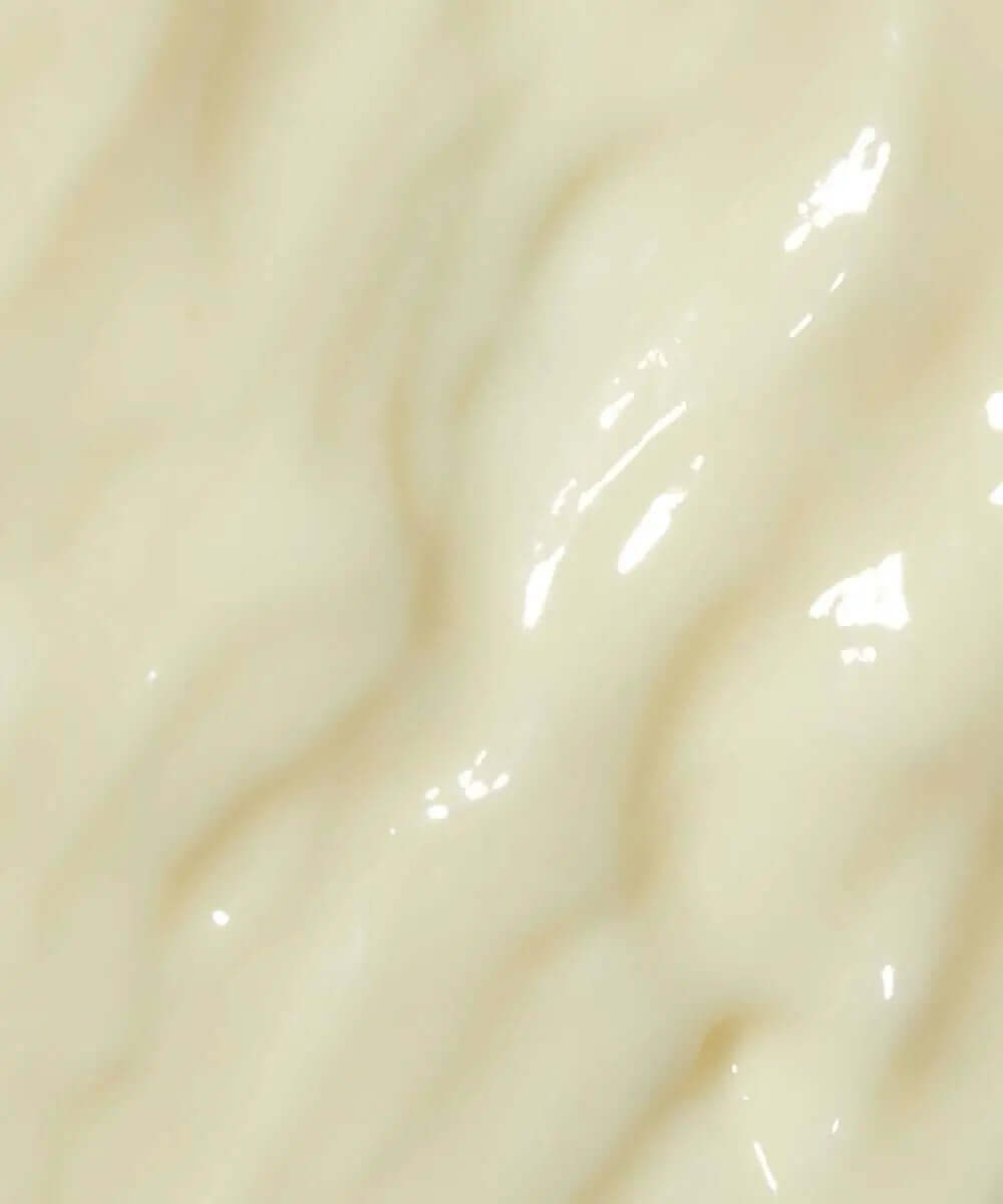 Close-up of MIELLE ORGANICS Rosemary Mint Daily Styling Crème, showcasing its creamy, smooth texture.