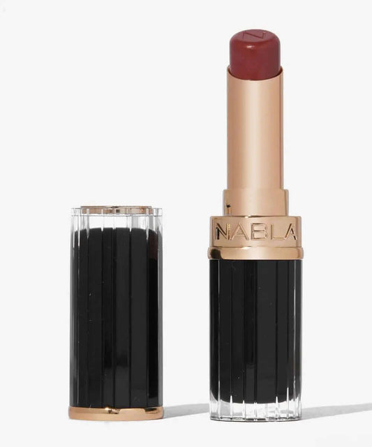 NABLA Beyond Jelly Lipstick in a chic black and gold tube, showcasing glossy burgundy color and hydrating formula.