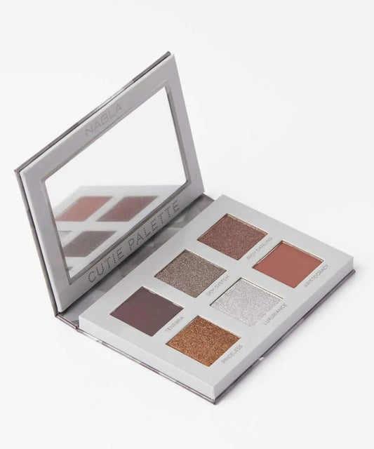 NABLA Cutie Palette Platinum featuring six cool-toned eyeshadows in various finishes, perfect for vibrant makeup looks.