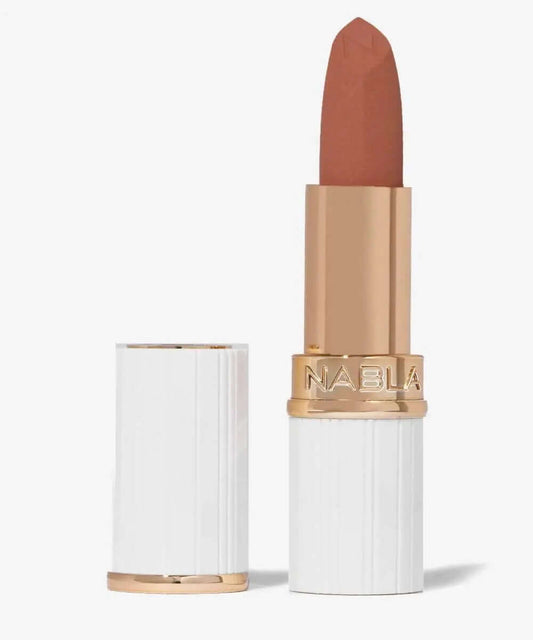 NABLA Matte Pleasure Lipstick in creamy matte finish, showcasing a warm nude shade with elegant packaging.