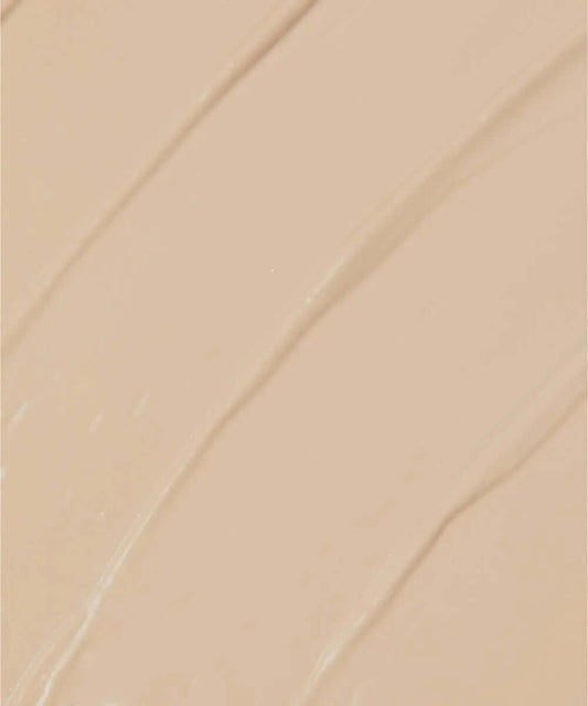 Close-up of NABLA Re-Generation Concealer in a creamy beige shade, showcasing its smooth texture.