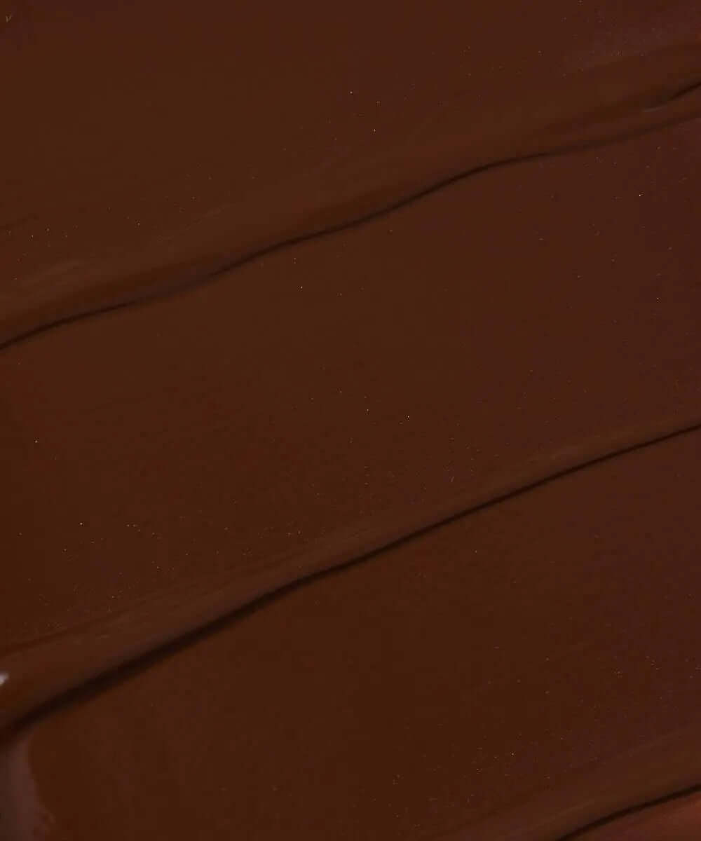 Close-up of NABLA Re-Generation Concealer shade in dark brown, showcasing its creamy texture and rich pigmentation.