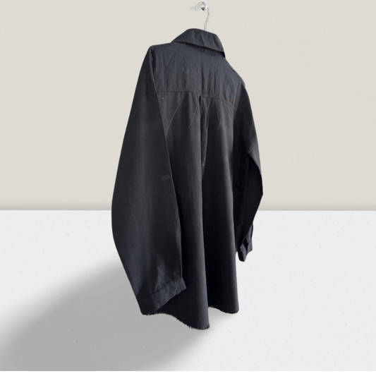 NED Black Linen Shirt displayed on a hanger, showcasing its relaxed fit and lightweight black fabric for TheGoodVibes.