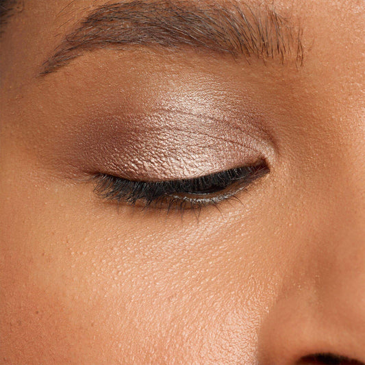 Close-up of an eye wearing NUDESTIX Magnetic Luminous Eye Colour in Burnish, showing a satin finish and vibrant color.