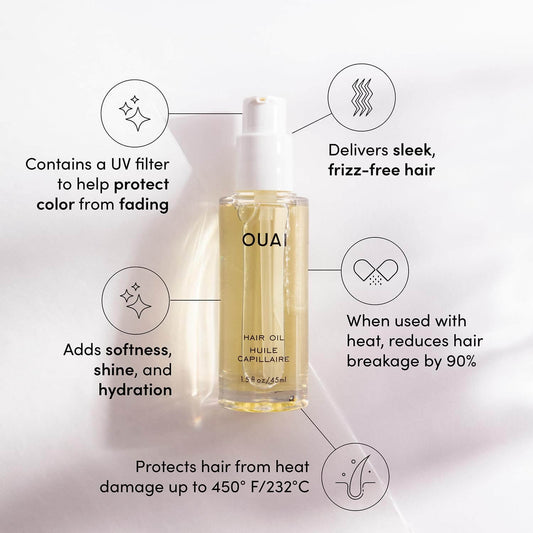OUAI hair oil bottle with features listed on a light gray background
