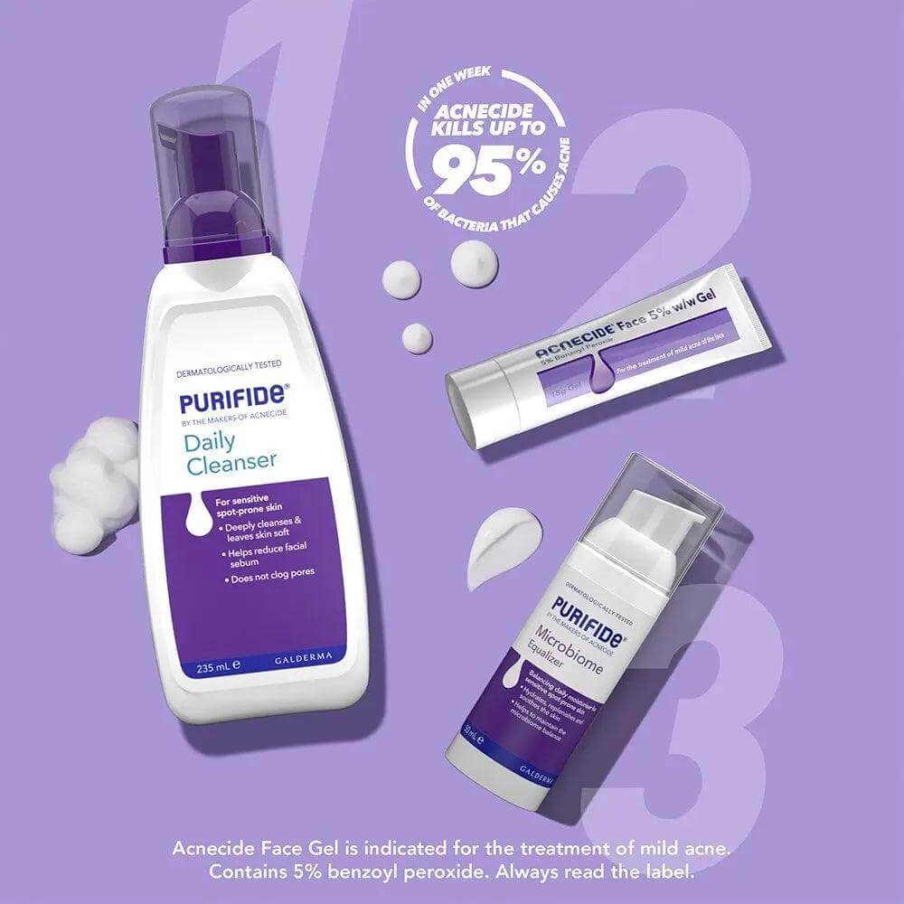 Purifide by Acnecide Daily Cleanser 235ml with other acne treatment products, promoting gentle care for blemish-prone skin.