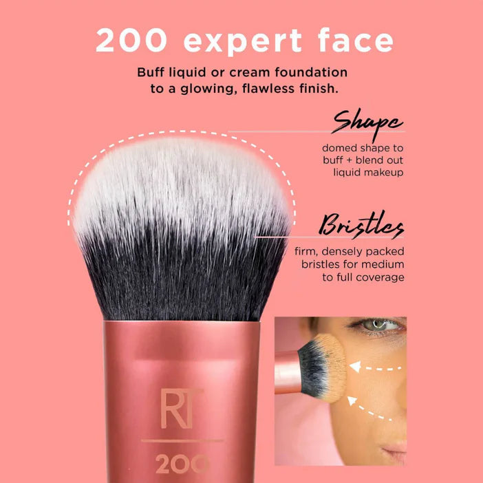Real Techniques Makeup brush with pink handle and black bristles on a pink background, featuring text about its use.