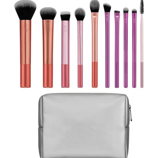 Set of Real Techniques makeup brushes with gradient handles and a gray case on a white background