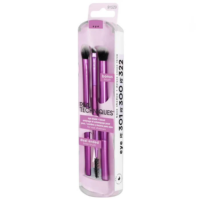 Set of makeup brushes in a pink packaging with Real Techniques branding on a white background.