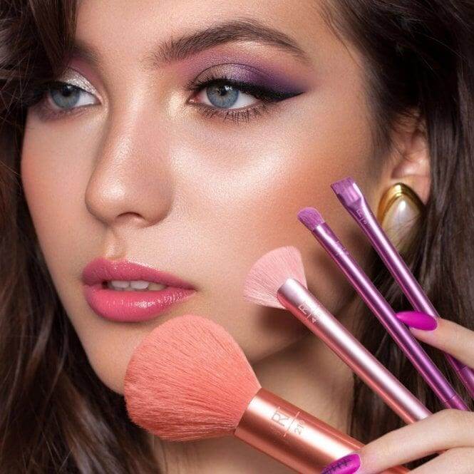 Model showcasing Real Techniques Insta Artist 9 Piece Makeup Brush Set with vibrant makeup and various brush styles.