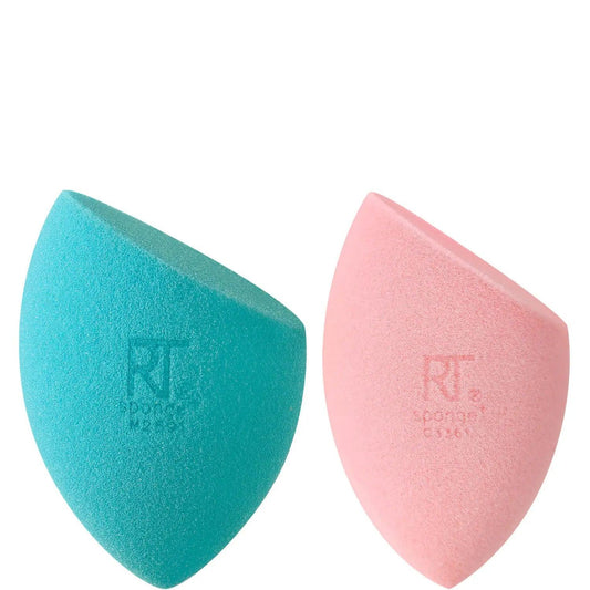 Real Techniques Miracle Mattifying Duo sponges in teal and pink for flawless makeup application.