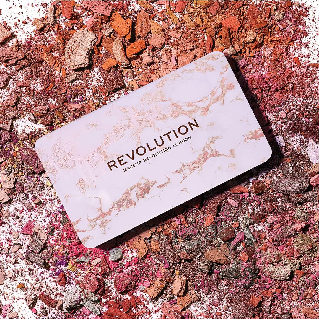Makeup Revolution palette on a colorful powder background
