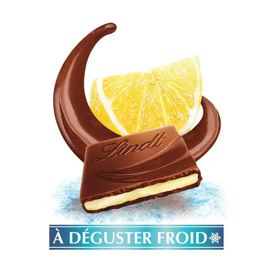 Chocolate candy with a lemon wedge and Lindt logo on a white background
