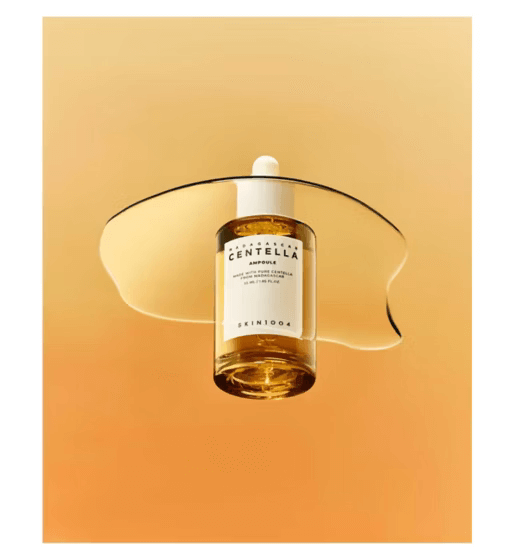 SKIN1004 Madagascar Centella Ampoule, lightweight serum for sensitive skin on a gradient orange background.