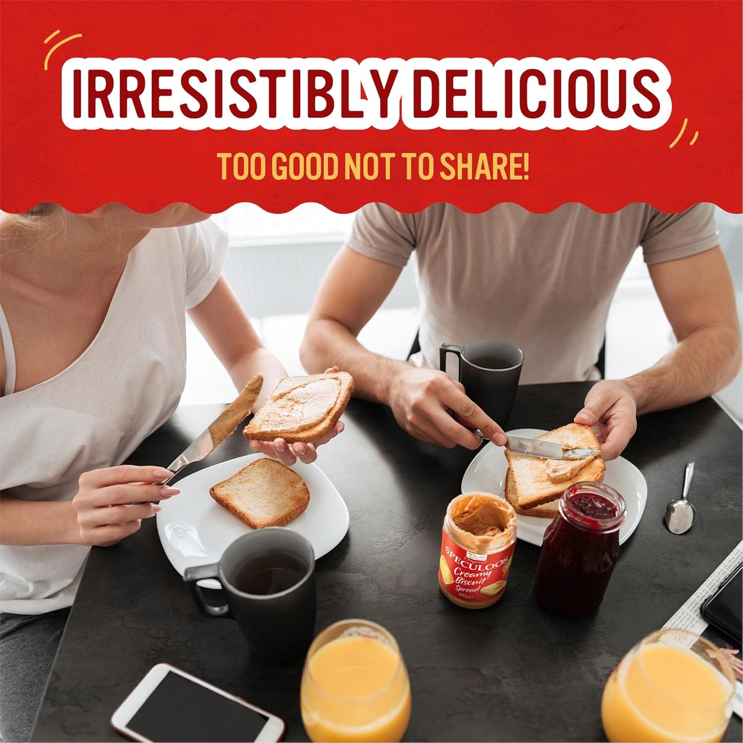 Two people sharing breakfast with Speculoos Creamy Biscuit Spread 400g on toast, surrounded by drinks and joy.
