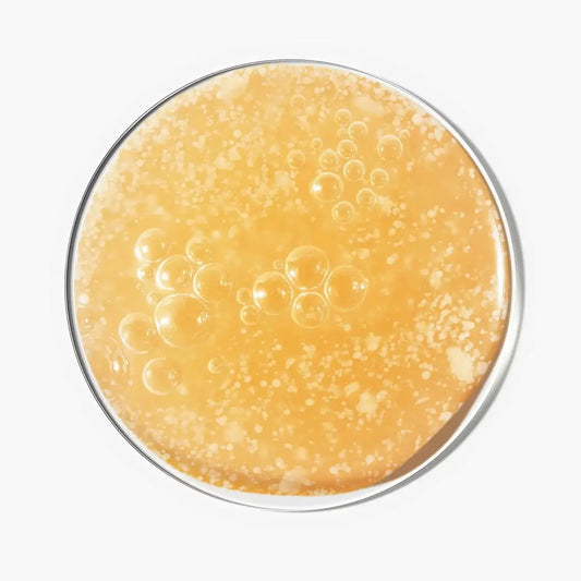 Close-up of The INKEY List Glycolic Acid Exfoliating Scalp Scrub showing bubbly exfoliating texture.