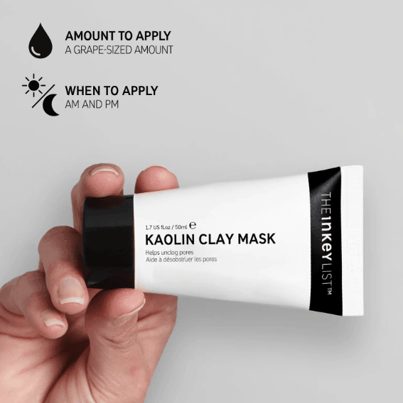 Hand holding The Inkey List Kaolin Clay Mask tube, showing usage instructions for amount and application times.