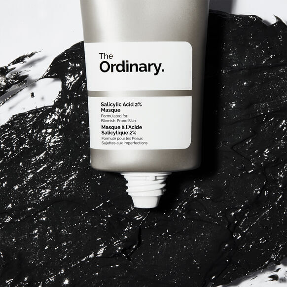 The Ordinary skincare product on a textured black and white background